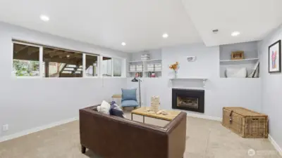 his lower-level living room completes the rental setup, offering a cozy and functional gathering space