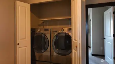 Washer and dryer upstairs with bedrooms