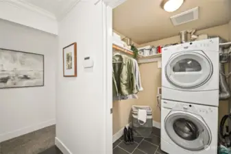 Laundry area with stackable washer and dryer.
