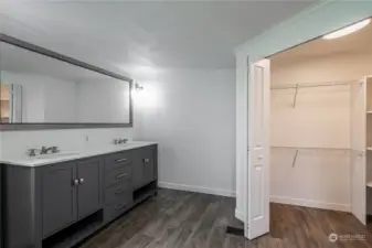 Primary vanity with double sinks and walk in closet