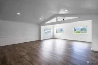 Spacious living area with vaulted ceiling