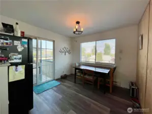 The kitchen nook has lots of space and a slider to the deck.