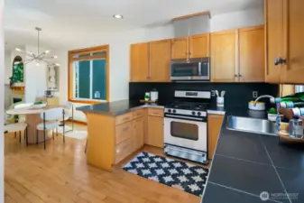 Chef's kitchen has abundant storage, stainless appliances and good work space.  Hardwood floors are found throughout.