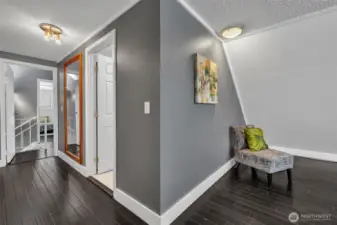 Primary is large with extra sitting space and a wall of closets