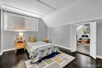 This upstairs bedroom has a fun access point to...