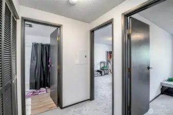 Hallway to both bedrooms and the bathroom