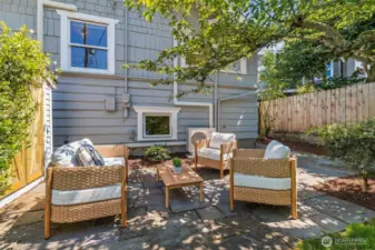 Shaded by mature fruit trees, this backyard is a true slice of paradise