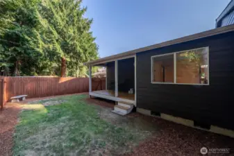 Fully fenced back yard with private deck.