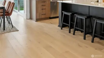 Beautiful wide-plank flooring delivers both visual impact and timeless elegance.