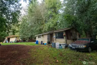 Opportunity awaits on this expansive lot featuring a 920 sq ft home ready for a majorl renovation or tear-down. With a detached two-car garage, utilities in place, and Tahoma School District location, this property is primed for redevelopment. Value is in land and existing on site utilities, electricity, water and septic.