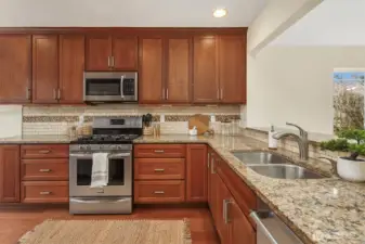 Quartz counters & stainless appliances.