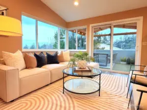 The living room features a vaulted ceiling, new windows throughout with recessed lighting.