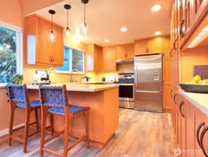 The kitchen remodel includes new maple cabinets, countertops, and all new appliances.