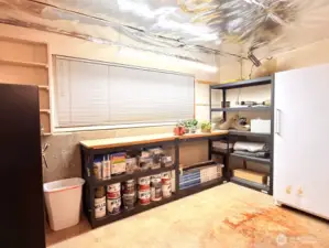 The one car garage was converted to a useful storage and work area. There is a wall in the center that could be taken out if you would like to use the whole garage to park.