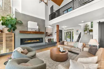 Impressive 6' tile surround fireplace with granite hearth and reclaimed old-growth beam pillars salvaged from a Seattle pier are a highlight.