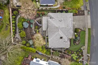 The large lot with professionally designed landscaping provides multiple areas to enjoy your new home.