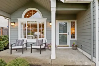 The inviting, covered front porch is perfect for taking in the neighborhood or welcoming guests.