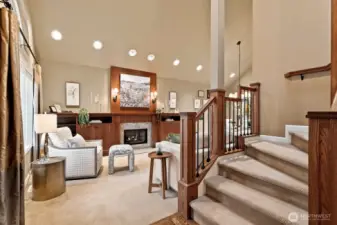 Vaulted, light-filled living spaces showcase enhanced lighting, a gas fireplace and custom cherry built-ins crafted with true artisan precision.