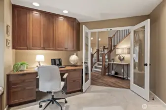 The office is a standout with custom warm cherry built-ins and ample storage.