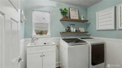 Convenient upper-level laundry room designed to make everyday tasks simple and efficient.