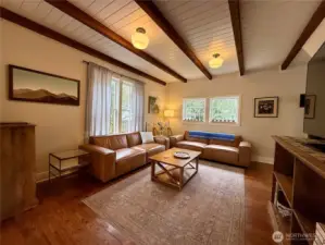 Warm hardwood floors throughout both the living room and family room.