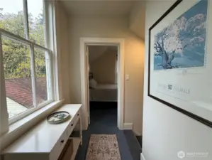 Looking from the upstairs landing into the guest bedroom.