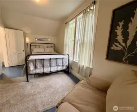 Second level guest bedroom also enjoys lots of natural light through the large windows.