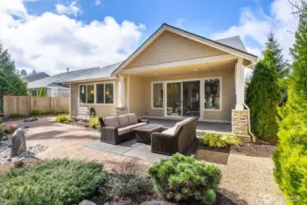 Backyard is low maintenance and includes sprinkler system throughout