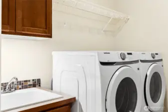 Useful utility sink with under cabinet ligting and the washer and dryer are included, only 2 years old.