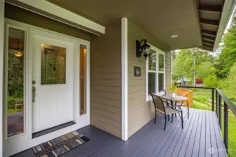 Covered front porch is so inviting.