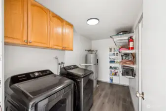 Upstairs located just off the kitchen area is a nice sized laundry room w/ room for extra storage and separate door out to pool deck.