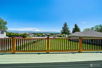 Another incredible view from the front deck- imagine getting your coffee and soaking up the sun on this deck with a lush yard & a view like this!