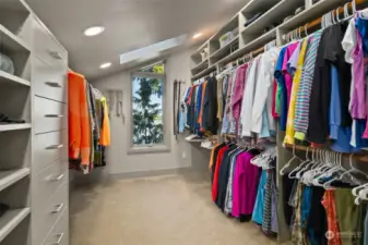 Walk-in closet w/ custom built ins, waterview and skylight.