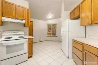Tile flooring through Kitchen and Dining.