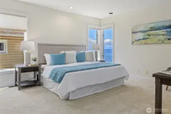 Primary bedroom with a lovely view on main level.