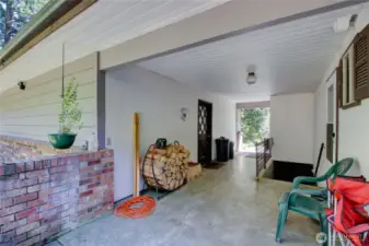 Breezeway from house to garage and stairs to basement