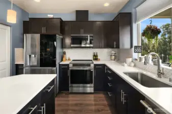 Elegant and light-filled, this kitchen will bring out the chef in you. And don't you love that timeless tile backsplash?
