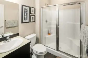 Hall bathroom next to second bedroom offers total separation from the primary suite.