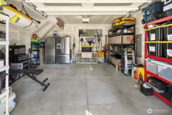 1-½ car garage provides plenty of useful extra space. (Refrigerator stays.)