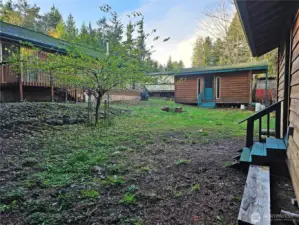 Two lovely outbuildings grace the backyard. Historically they have been used for storage, but perhaps a guest bedroom could be developed out here as well!