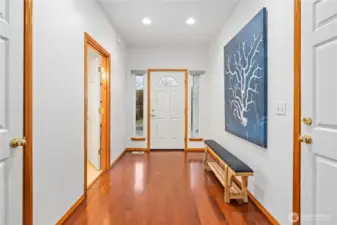 Another view of the foyer shows the main floor powder room to the left of the front entrance.