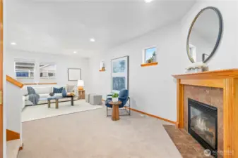 Step right into this bright and inviting living space accented with a tiled surround wooden mantle gas fireplace, creating a cozy and comforting ambiance. Fresh interior paint and plush carpeting throughout home.