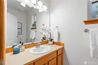Convenient main floor powder room discreetly located right off the front entrance.