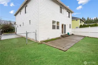 Backyard with digitally enhanced grass to show the potential of this backyard or keep as-is for a low-maintenance outdoor space.