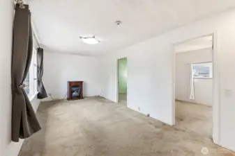 Spacious living room. Seller heated with the fireplace.