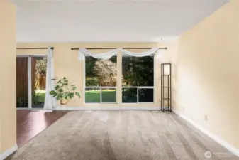 The living room is teeming with natural light throughout the morning and early afternoon.