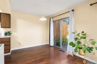 The dining area connects to a private, outdoor patio space