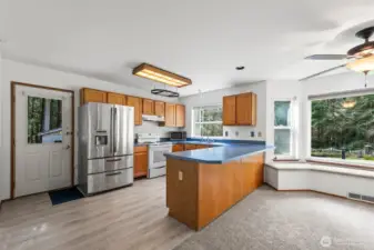 Functional kitchen with door to side yard.