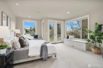 Luxurious primary bedroom suite with private balcony