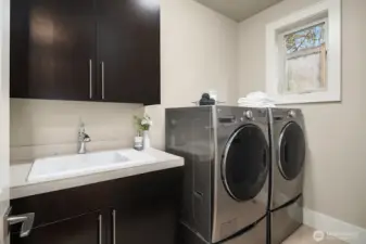 Utility room with full size washer and dryer